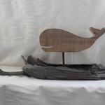 Whale cut-outs are made of 1" thick antique barn wood.  The driftwood has been collected from our local Eastern Long Island Beaches and from the Virginia Chesapeake Bay area. The entire piece measures 25" w x 11" h  