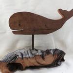 Whale cut-outs are made of 1" thick antique barn wood.  The driftwood has been collected from our local Eastern Long Island Beaches and from the Virginia Chesapeake Bay area. The entire piece measures 17" w x 13" h