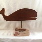 Whale cut-outs are made of 1" thick antique barn wood. The driftwood has been collected from our local Eastern Long Island Beaches and from the Virginia Chesapeake Bay area. The entire piece measures 22" w x 16" h.  This whale is on a red cedar slab cut from a piece of driftwood