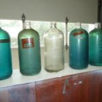 Vintage Seltzer Bottles.  The Glass looks like beach glass from handling....Never seen before with tops removed.  They Measure 9 1/2" tall
5 blue & 3 clear available.