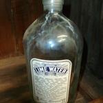 Vintage Apothecary Bottle.  Heavy Glass - Measures 9 1/4" tall & 4" wide  -  Labeled "LIME WATER"
